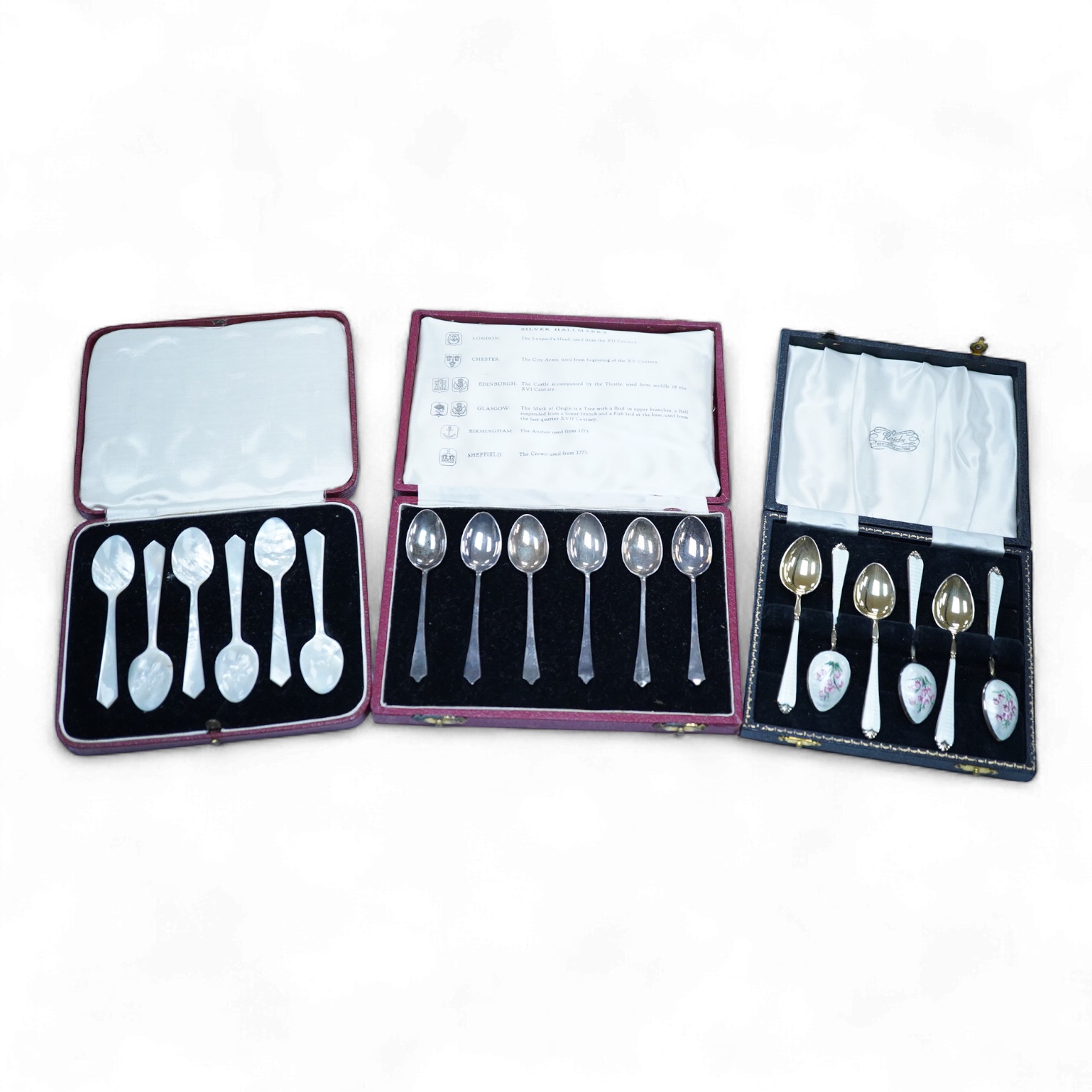 A cased set of six silver gilt and enamel coffee spoons, Adie Brothers, Birmingham, 1966, together with two other cased sets of coffee spoons including a mother of pearl set and a silver set.